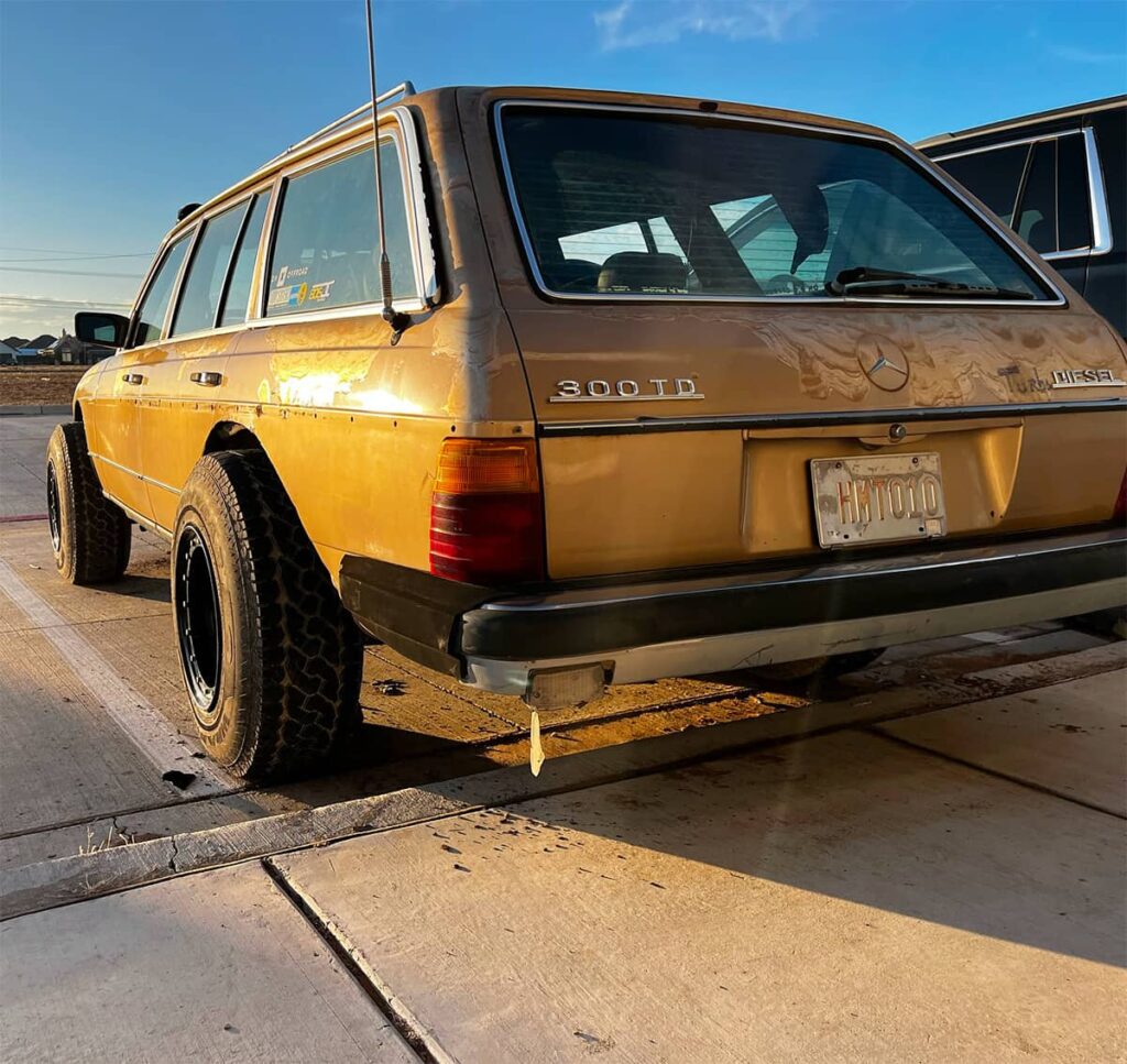 Mercedes W123 Wagon with cut rear fenders and oversized 31 inch off-road tires