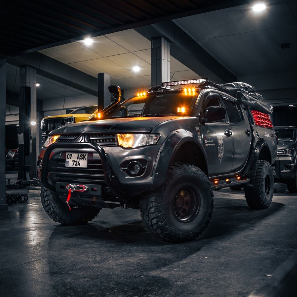 Lifted Mitsubishi L200 truck on 35" off road tires