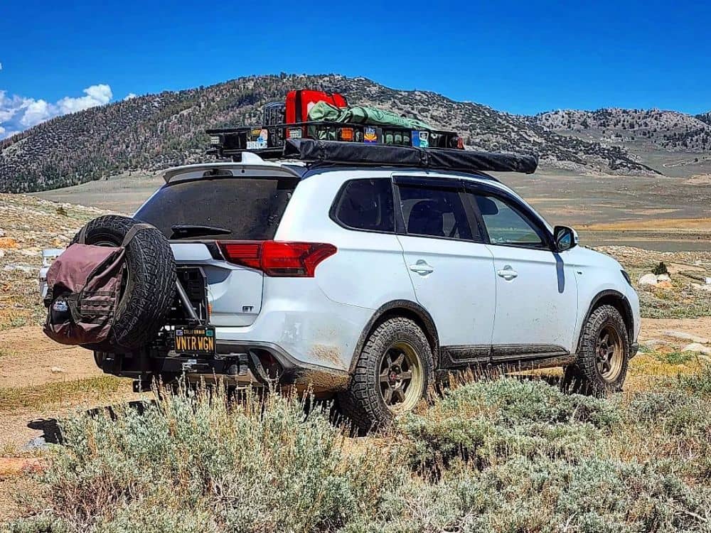 Mitsubishi Outlader modified for overland adventures on 245/70R16 off road tires