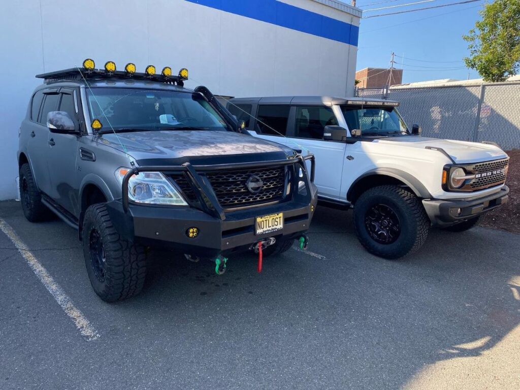 Lifted Nissan Armada compared to a Ford Bronco Sasquatch off road edition