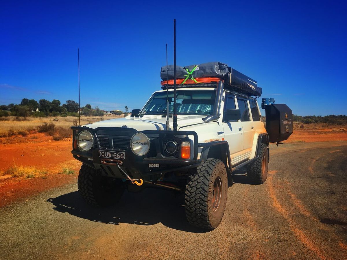 Custom steel off-road bumper with a skid plate and side brush bars (tire-width legal coverage)