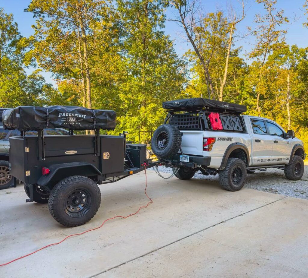 Nissan Titan Pro4X with overland gear towing an expedition trailer