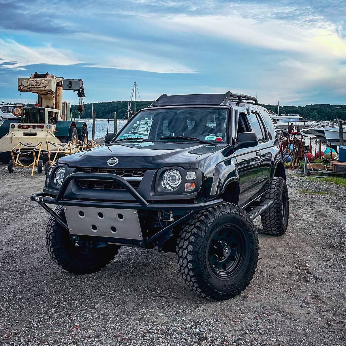 Black lifted Nissan Xterra off road build on 33" tires