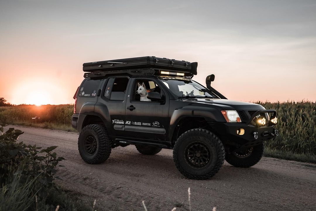 2nd Gen Nissan Xterra overlander with a 4 inch lift on coilovers and leaf springs
