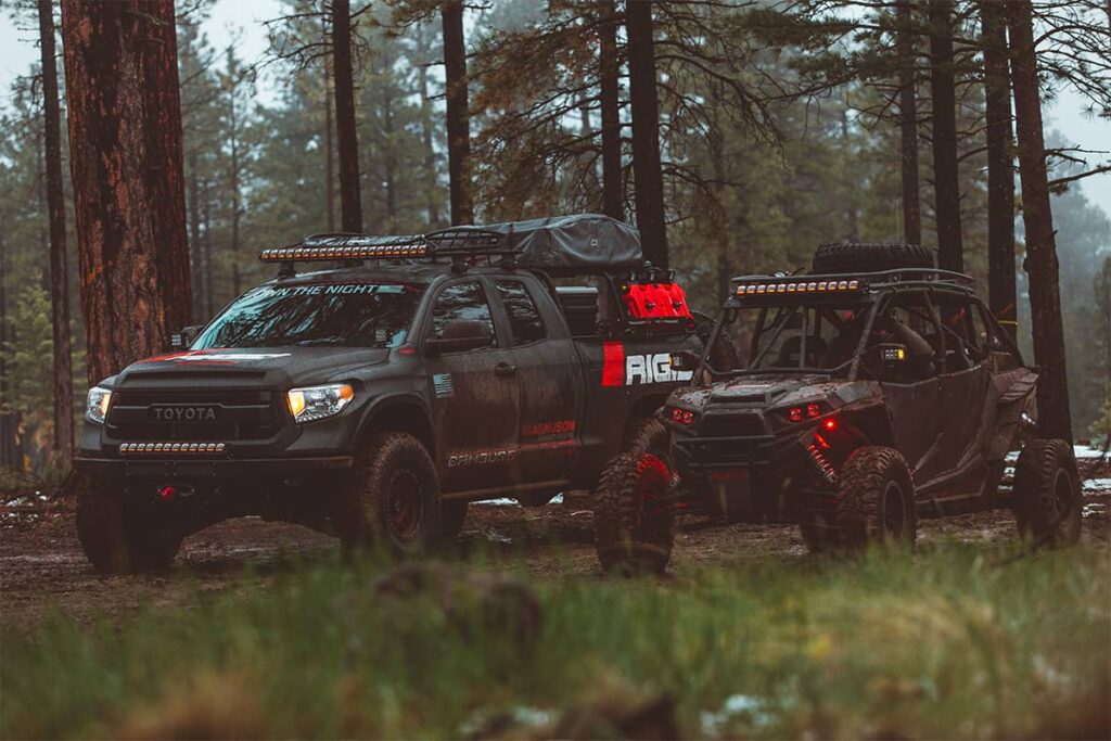 Black Toyota Tundra overland truck equipped with Adapt long LED lightbar and bumper mount LEDs