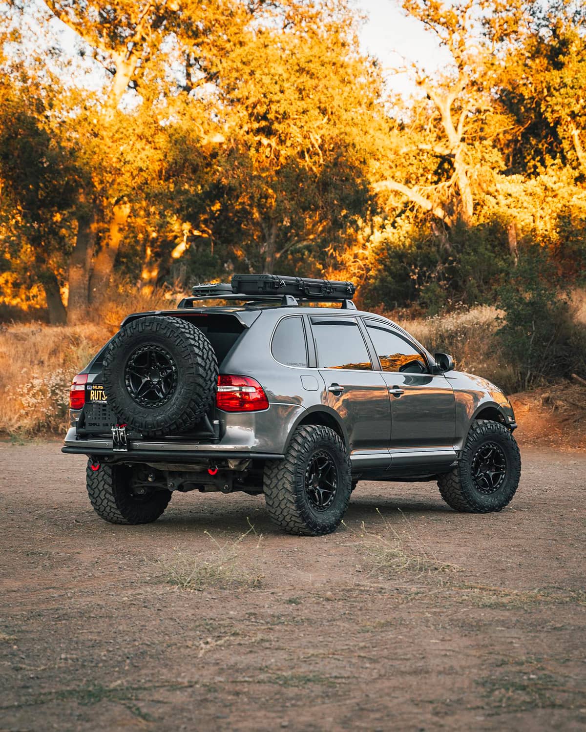 Lifted Porsche Cayenne 957 overland off-road build on 35 inch tires and pre-runner style bumpers
