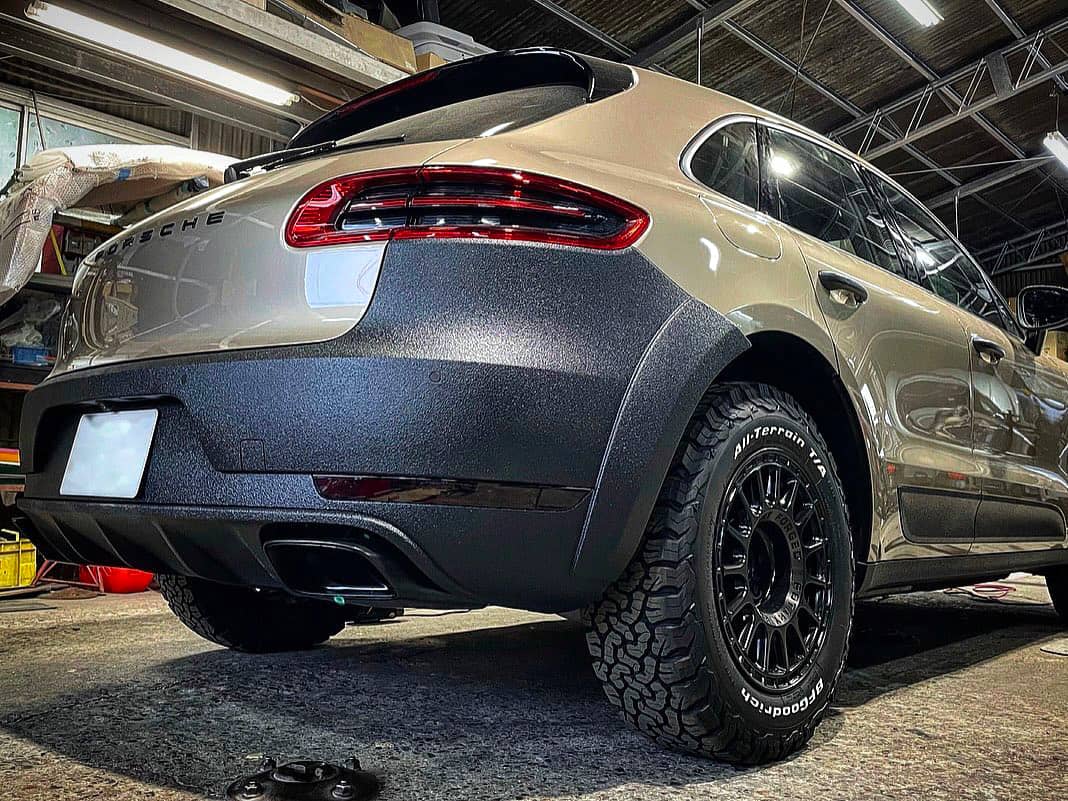 Porsche Macan with offroad rear bumper covered with LineX / Raptor coating