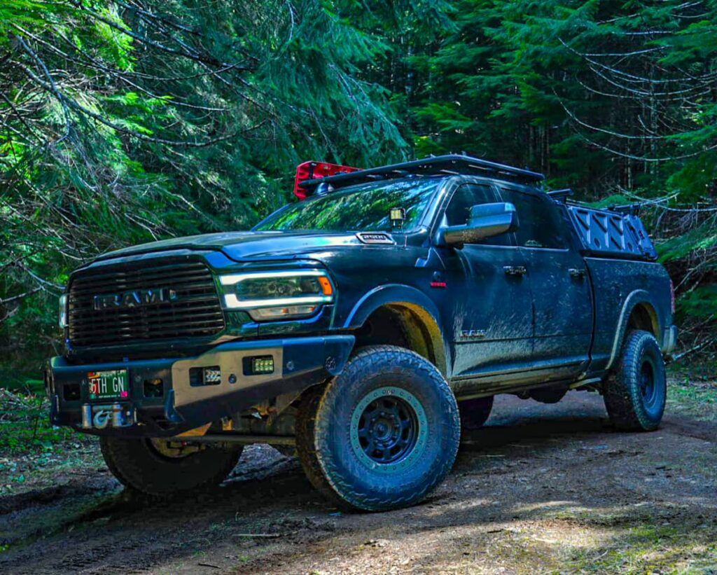 Offroading in the forest trails on a lifted Ram 2500 diesel overlander