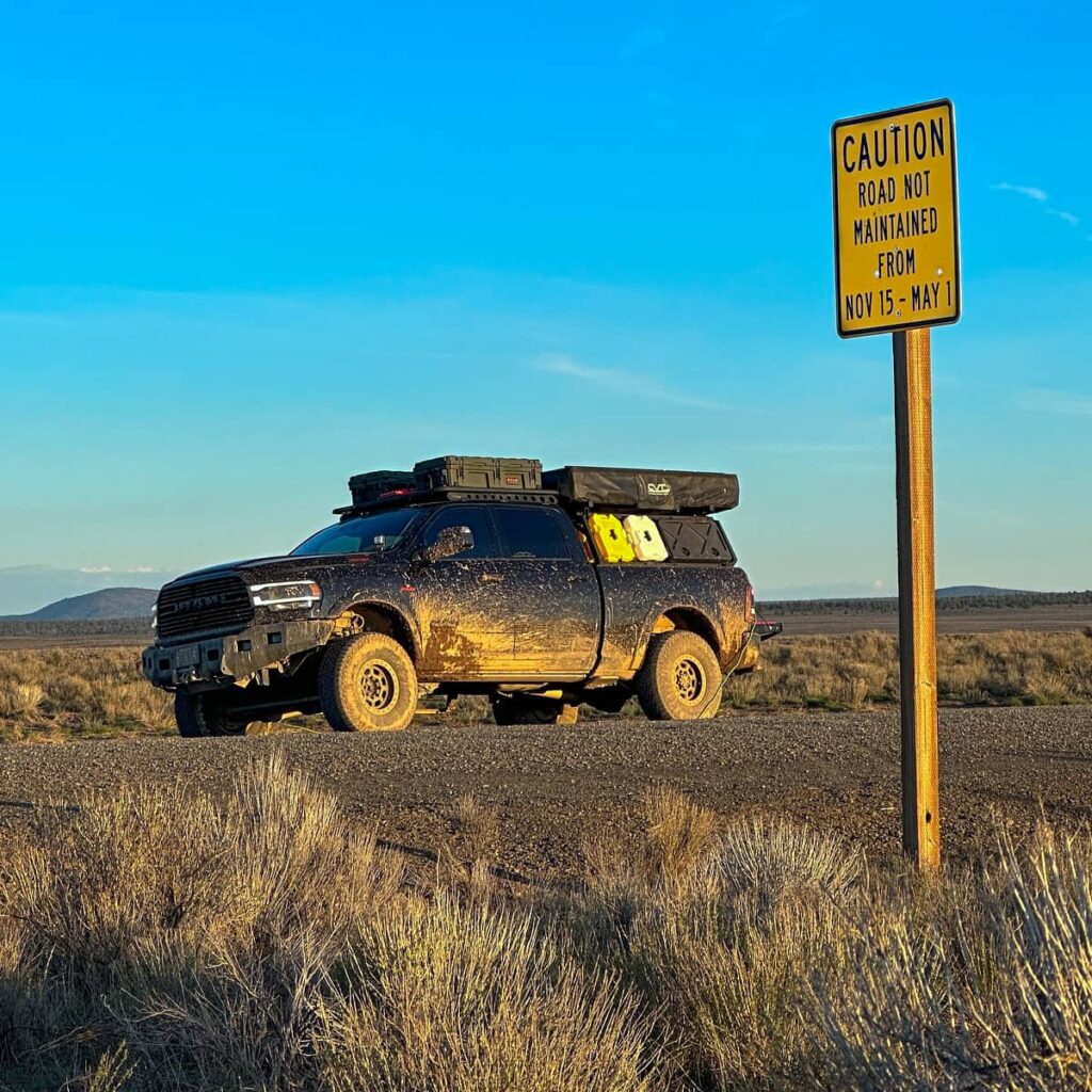Overlanding in the desert in a black Ram 2500 cummins
