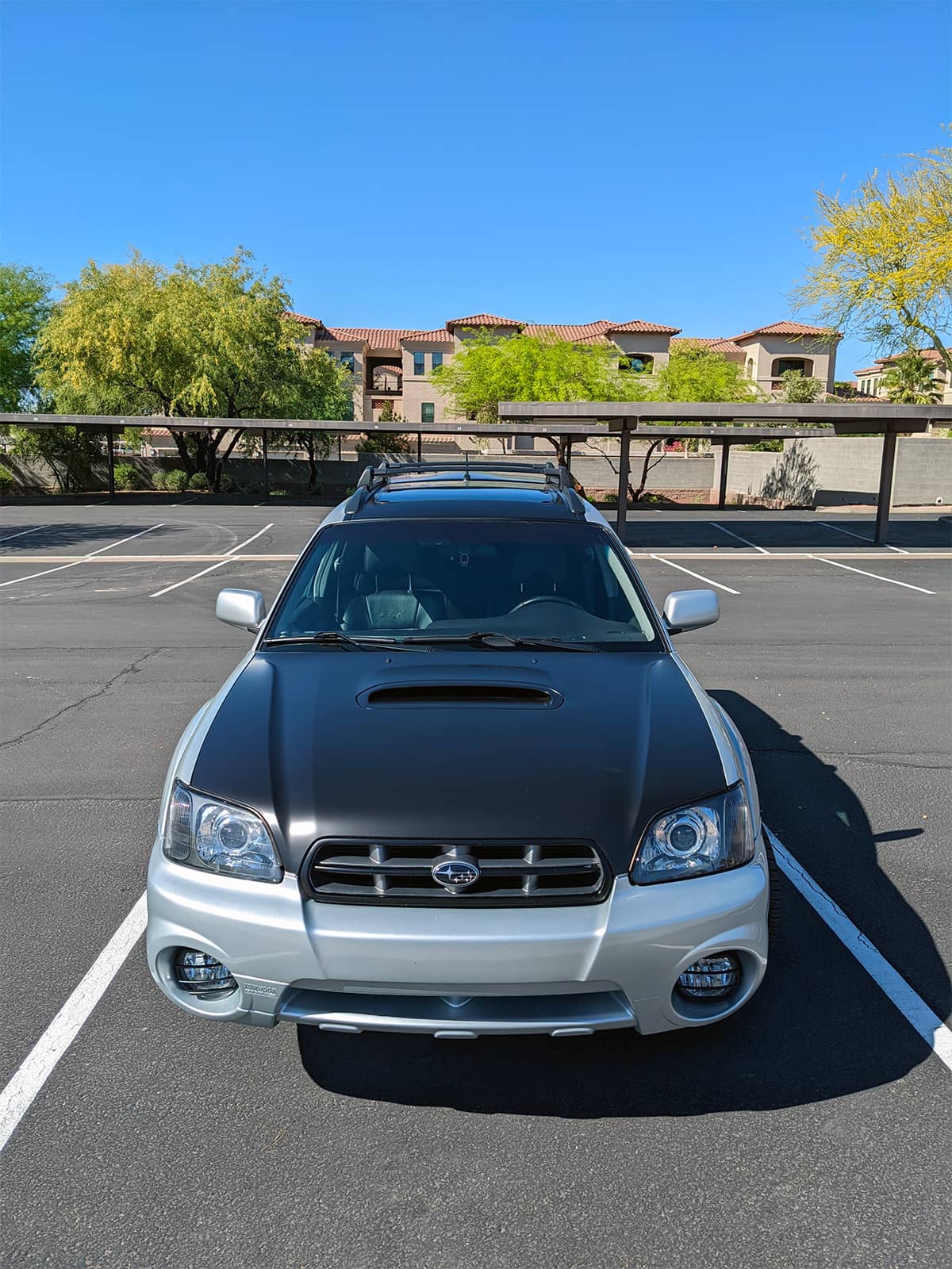 Subaru Baja with black custom hood and custom LED headlights