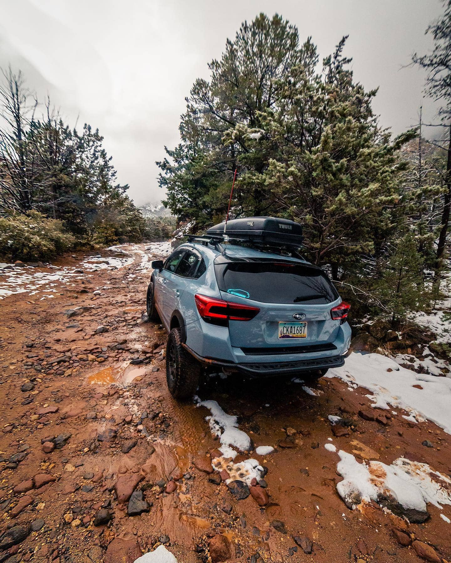 Subaru Crosstrek with a cargo box on the roof