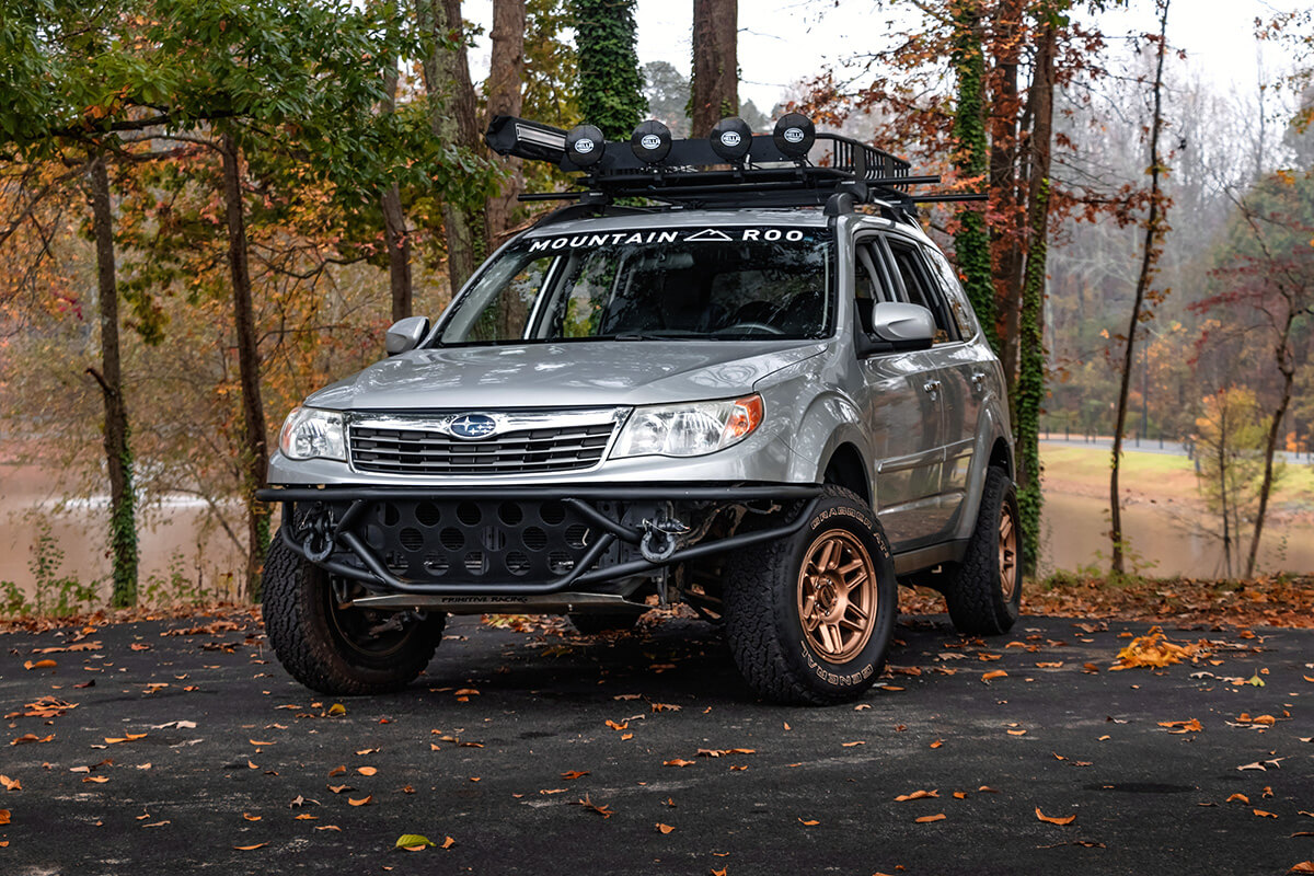 Silver Subaru Forester With off-road modifications