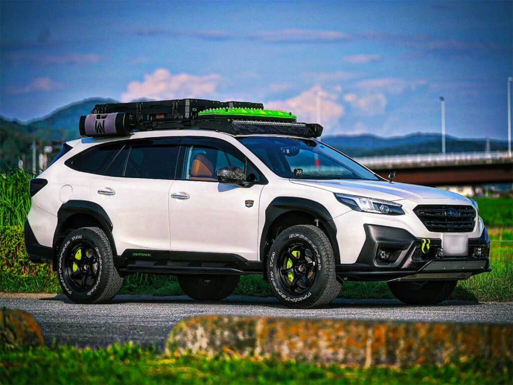 2024 White Subaru outback Wilderness with Lp Aventure Bumper guard, Lp Aventure Skid plate and a Prinsu Roof rack