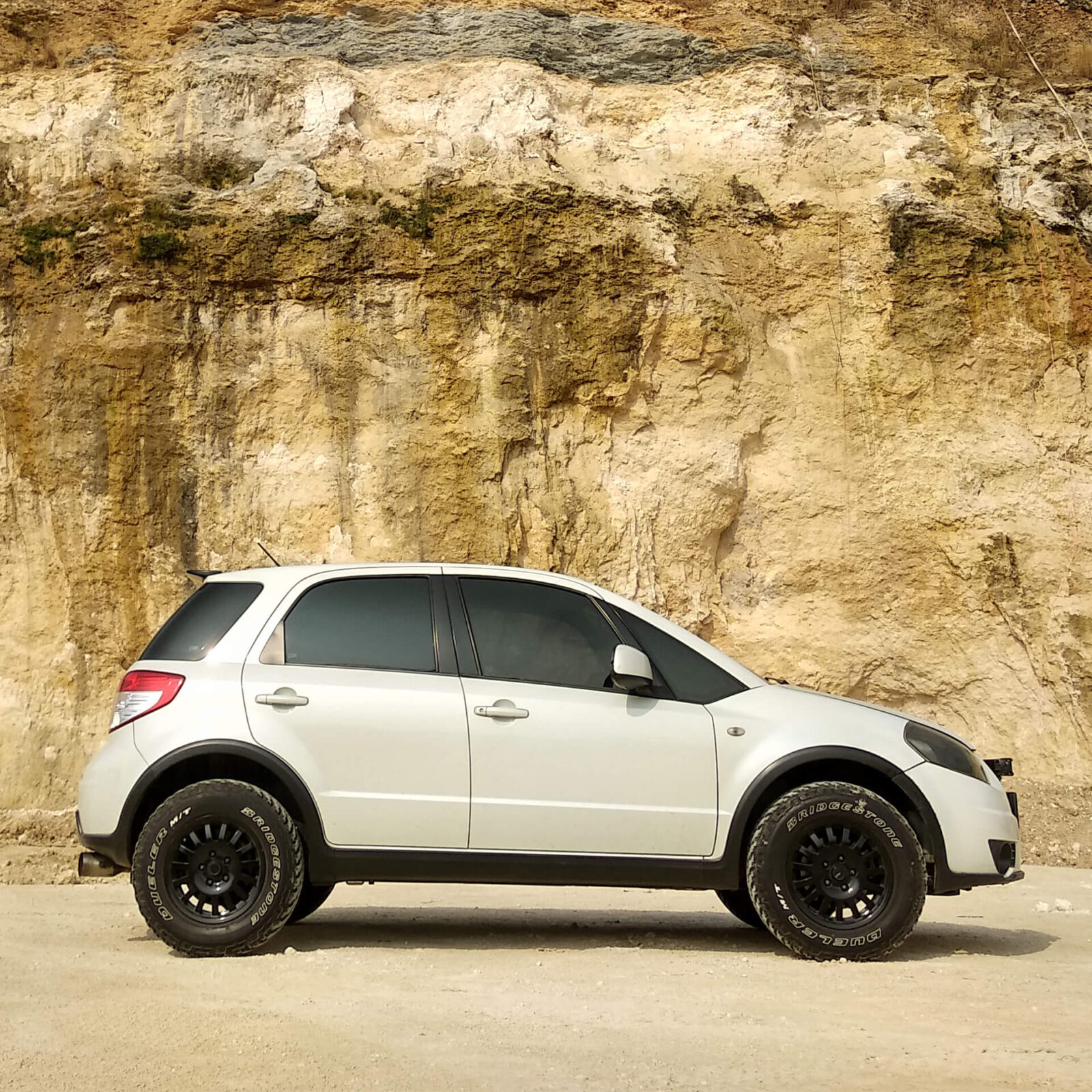 Lifted Suzuki SX4 With off-road wheels