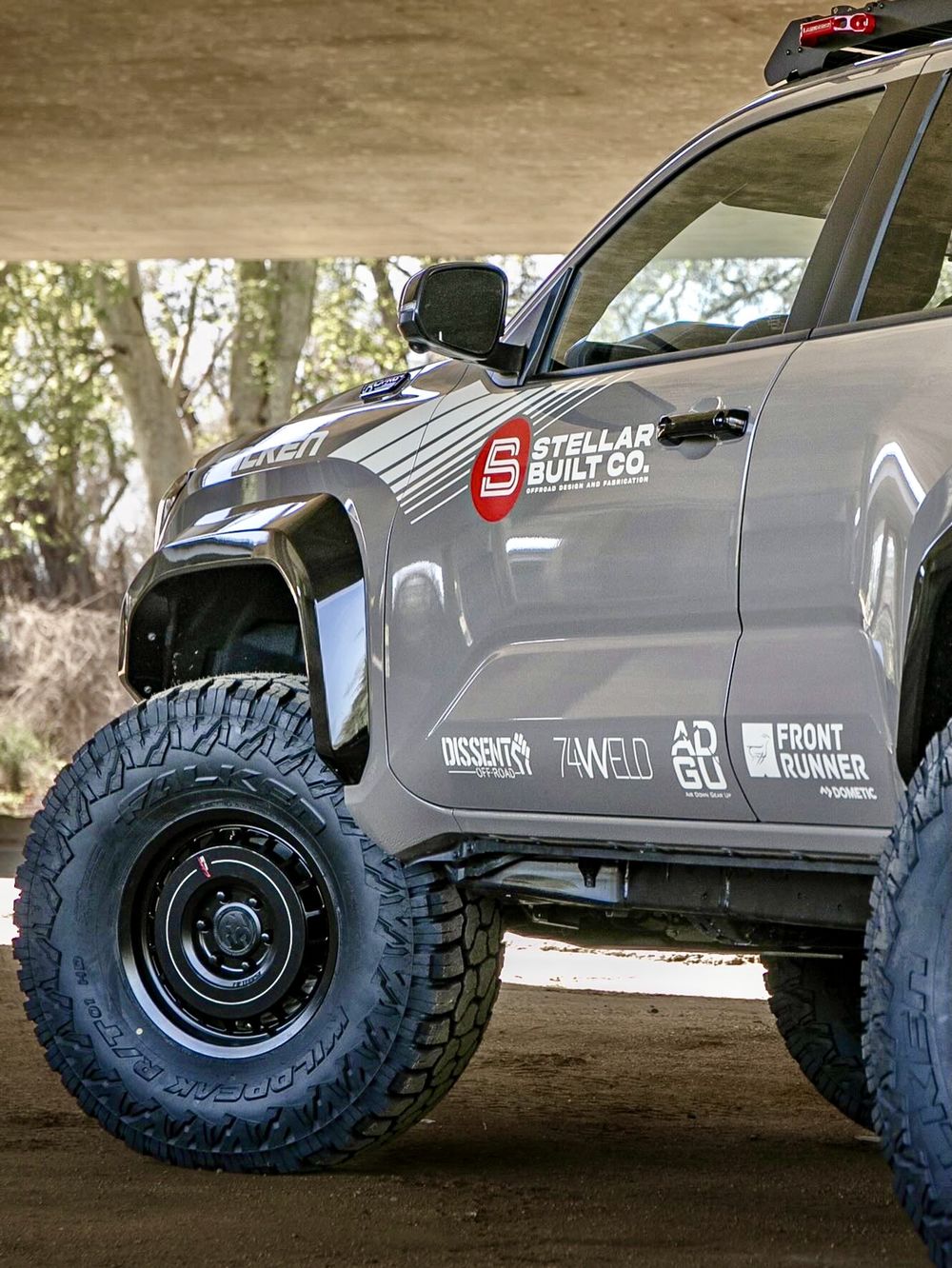 74Weld Gen 2 portal axle visible behind the front wheel of a grey 6th Gen 4Runner
