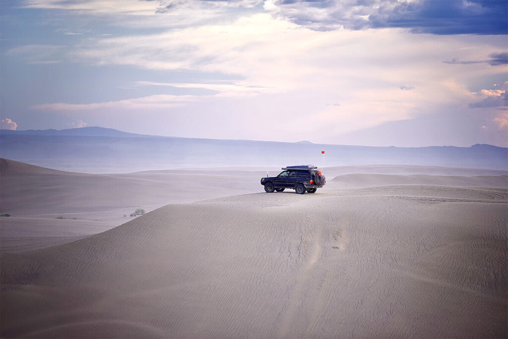 Toyota land cruiser in the desert and sand dunes