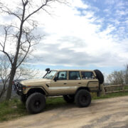 Lifted Landcruiser in tan color with cassic 4x4 sticker