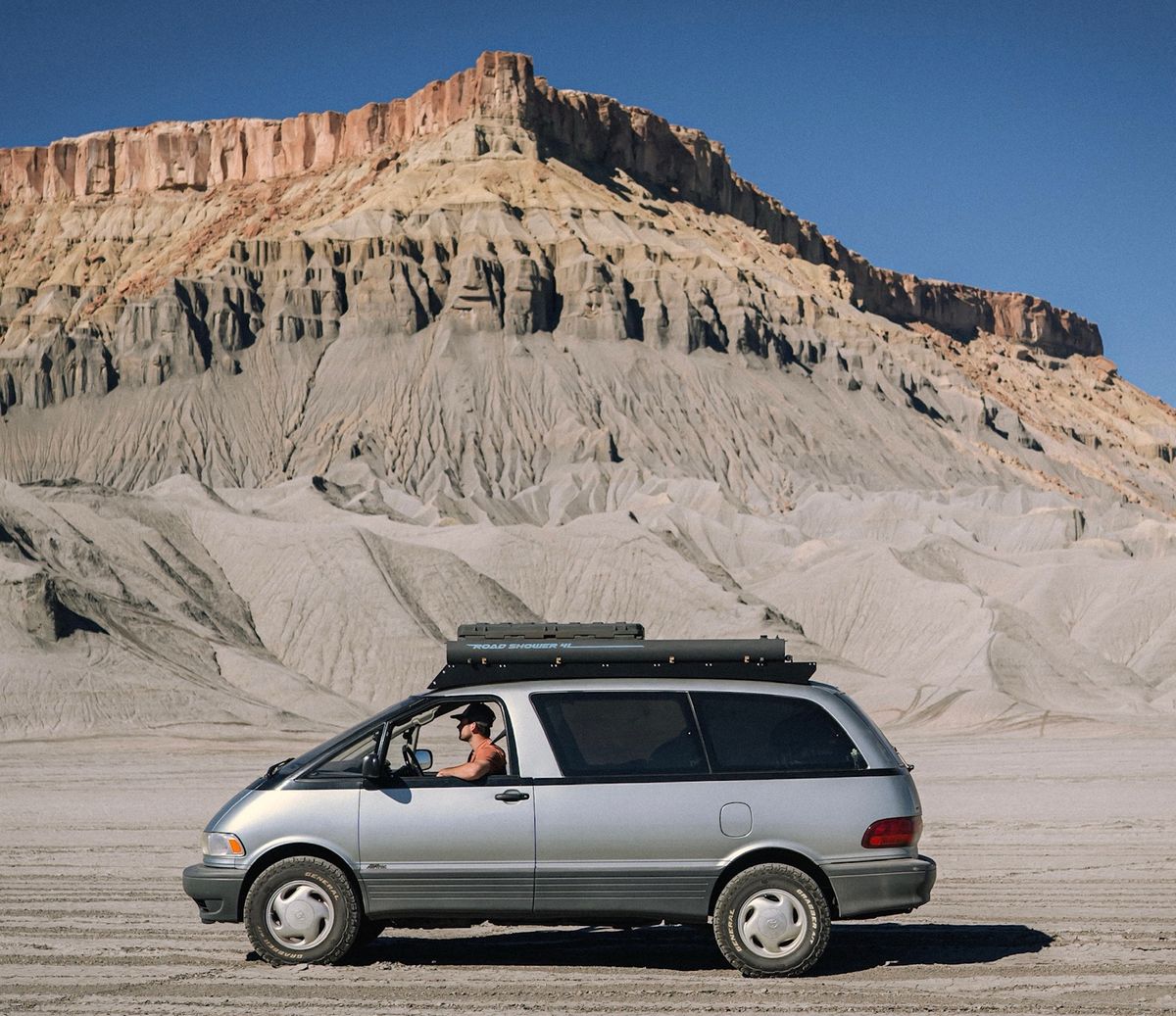 1994 silver Toyota Previa Alltrac S/C on a Utah OHV flat with a Yakima Road Shower on the roof