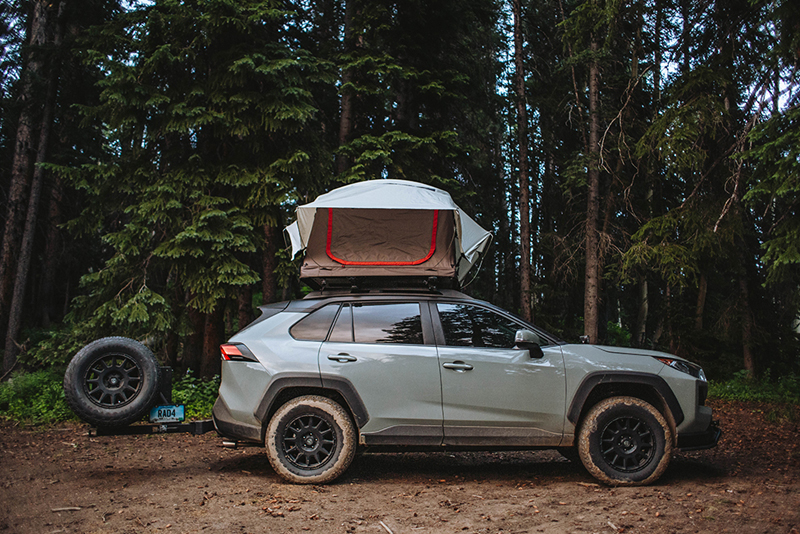 lifted rav4 with a roof top tent