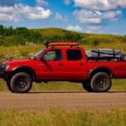 Yakima roof rack with pelican vault case and traction boards