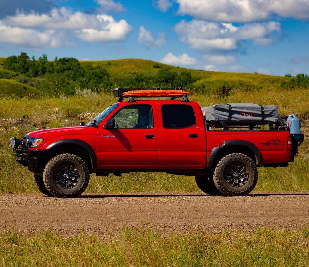 Yakima roof rack with pelican vault case and traction boards