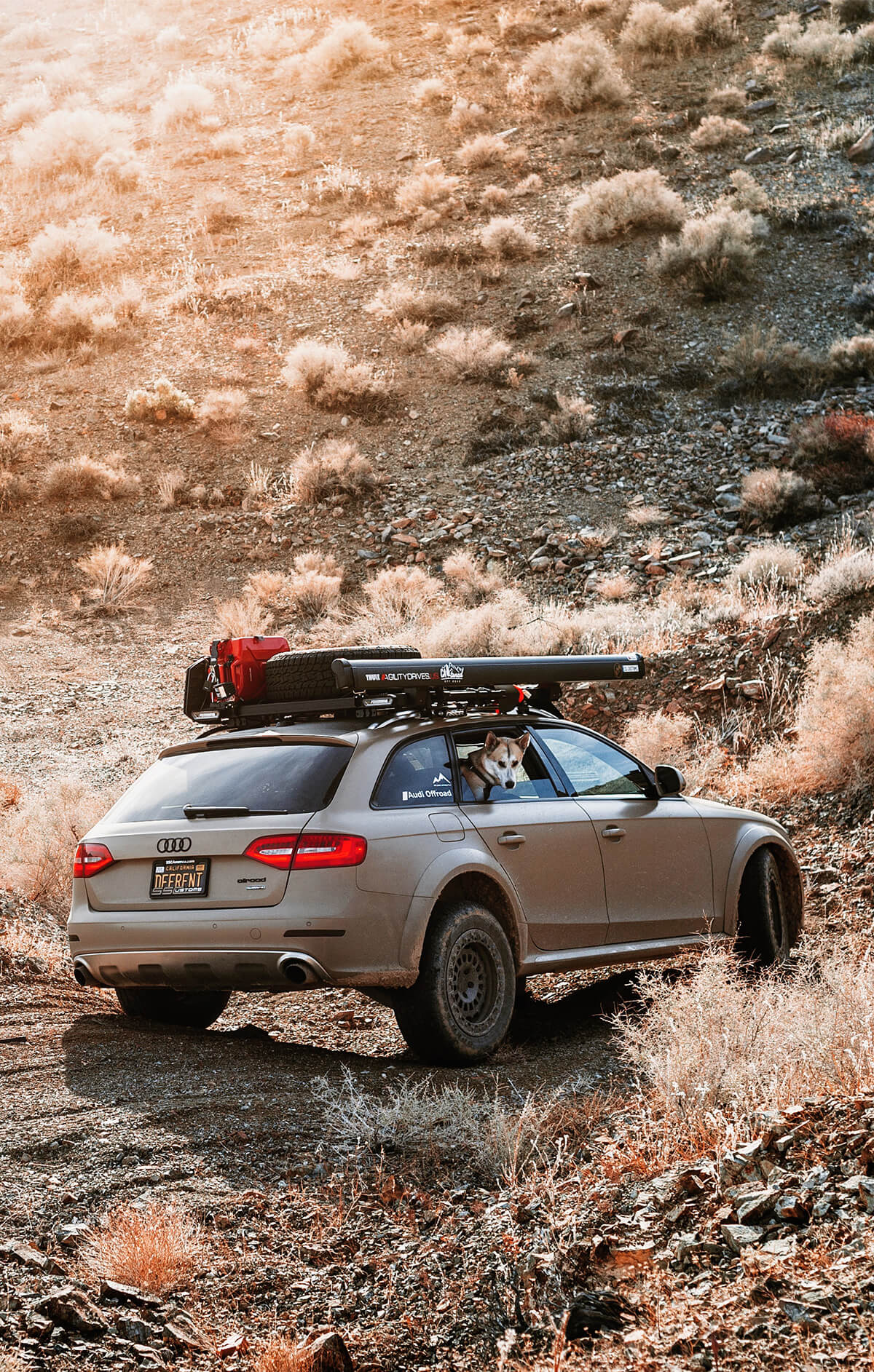 Lifted Audi Allroad With roof top tent and an awning