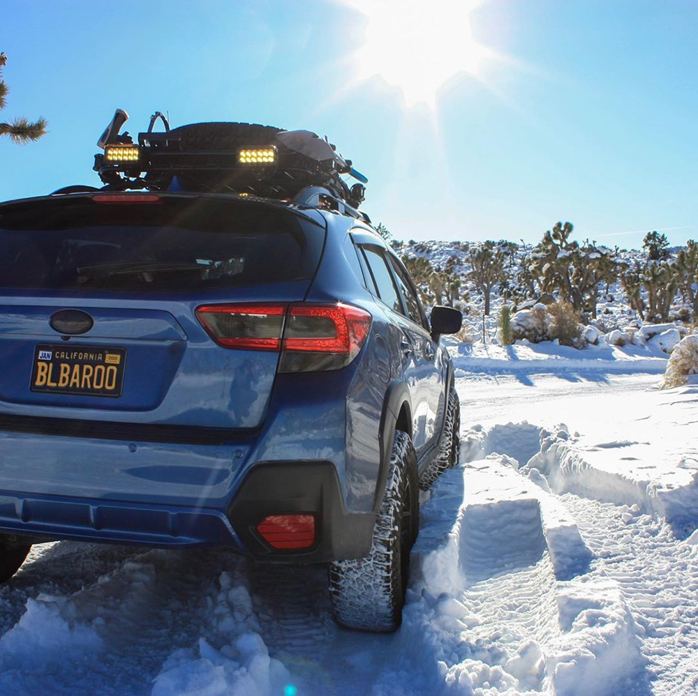 Blue subaru crosstrek with a 2 inch lift