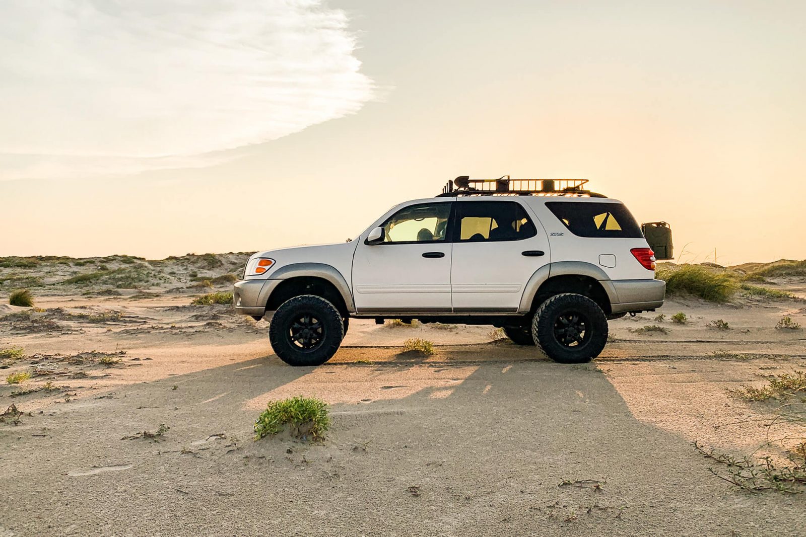 White 2003 Toyota Sequoia on ARB Old Man EMU 60020L Nitro Charger Shocks