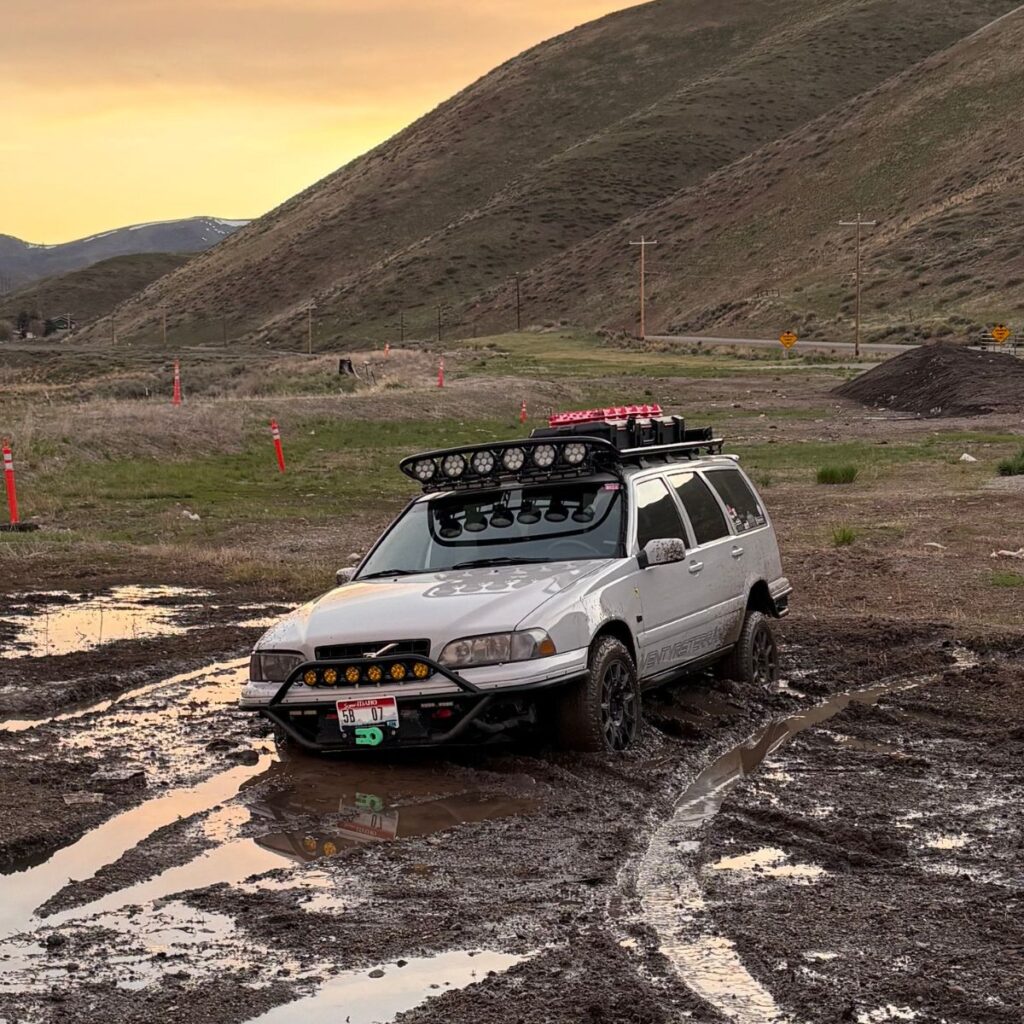 Driving in a deep dirt off-road in a lidted Volvo V70R with off-road bumper