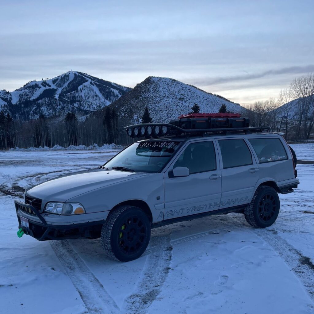 Offroading in the snow on volvo with custom off-road lights on the roof rack