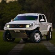 2020 Volkswagen Amarok in white with custom tubular front bumper and Baja Designs auxiliary lights