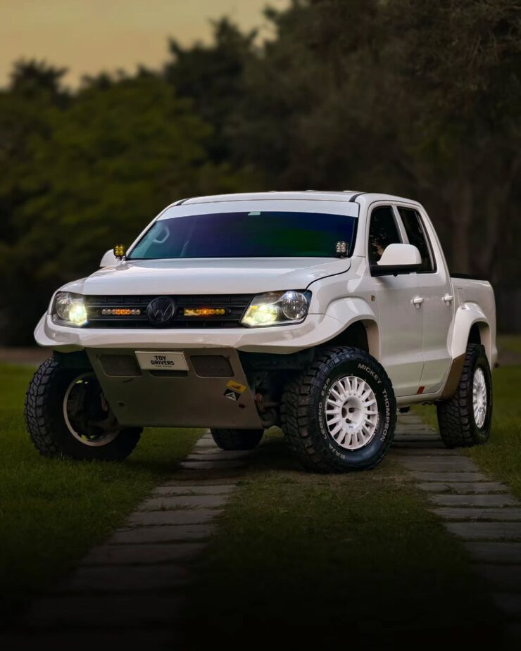 2020 Volkswagen Amarok in white with custom tubular front bumper and Baja Designs auxiliary lights