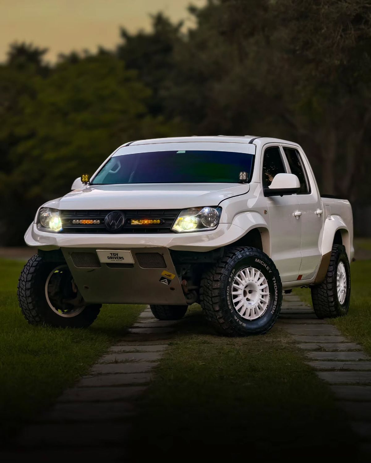 2020 Volkswagen Amarok in white with custom tubular front bumper and Baja Designs auxiliary lights