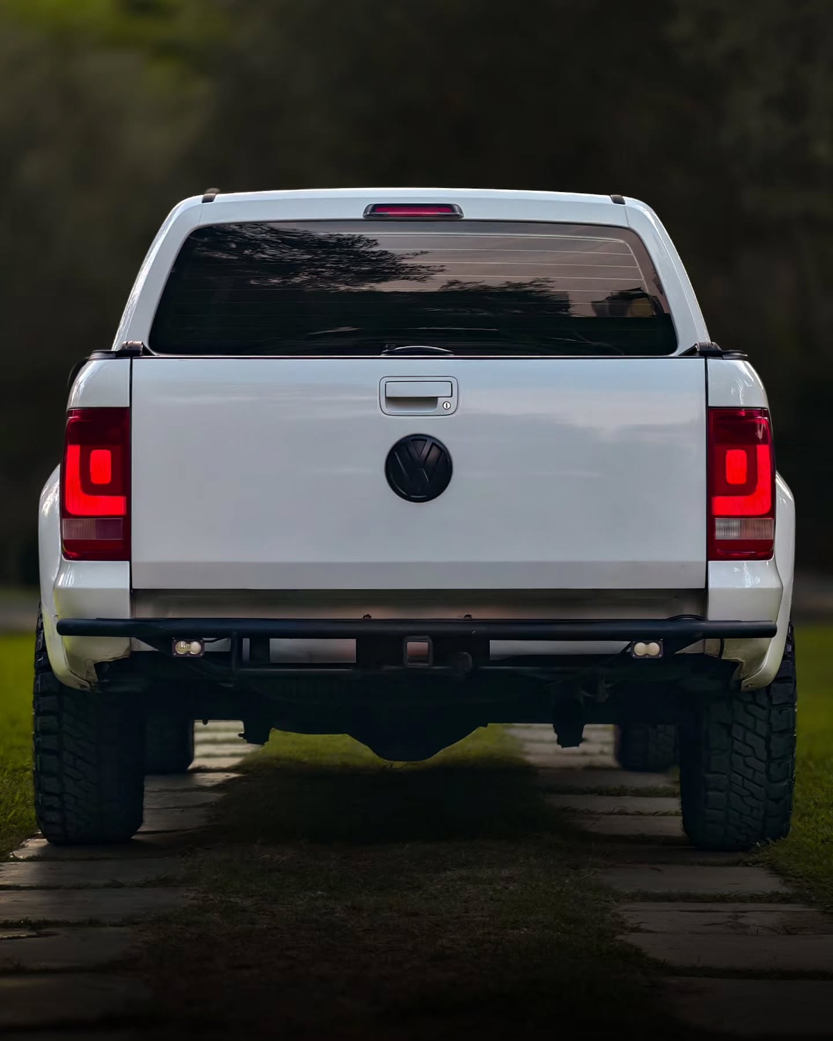 2020 white VW Amarok rally raid build showing custom wide-body kit from the rear