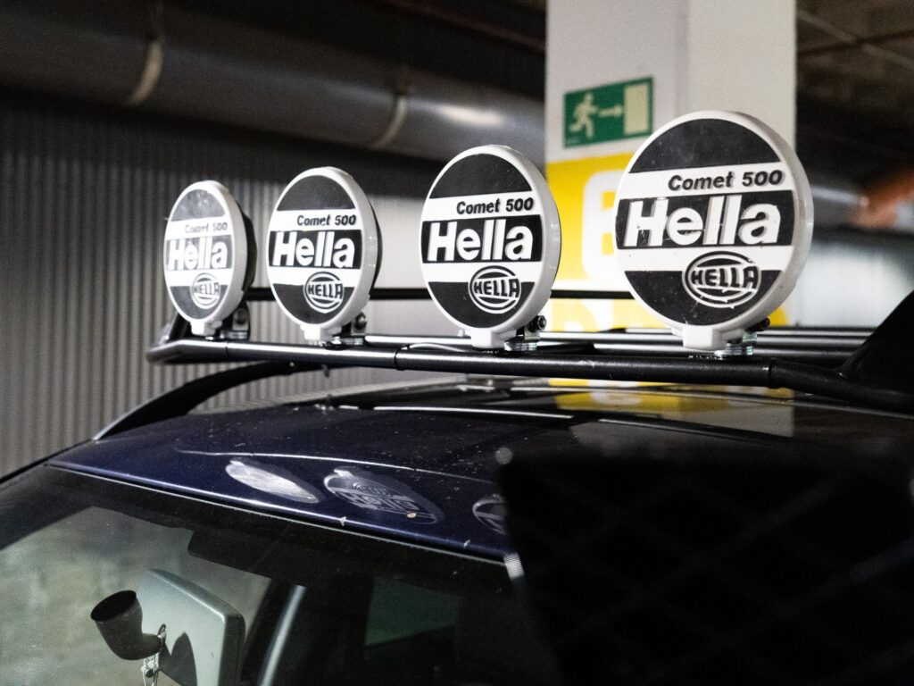 Up top sits a custom tubular roof rack fitted with a classy five-light Hella off-road light bar — a setup that gives this Golf a proper expedition look you'd normally see on a rally-prepped Pajero or a Patrol.