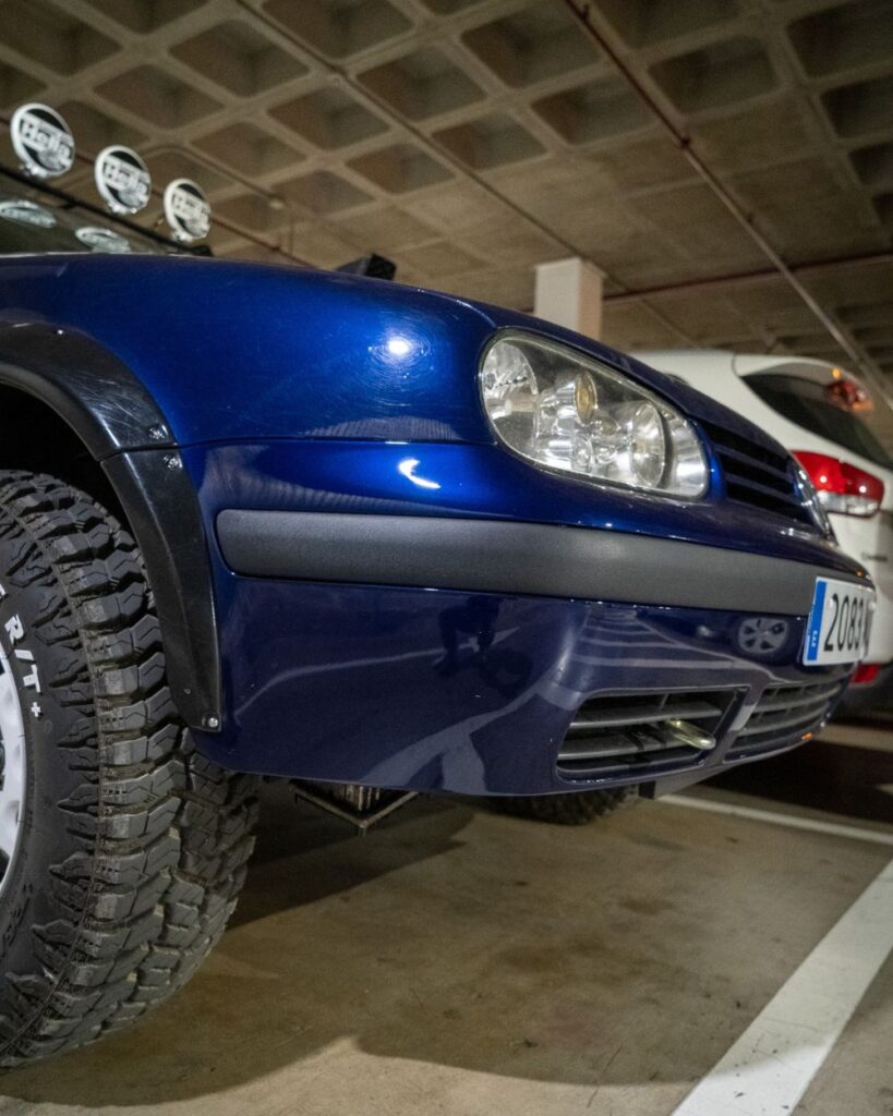 Moving your eyes to the bumpers, you'll notice a pretty common on the off-road scene bumper cut designed to improve the approach and departure angles — a little detail that instantly lets you know this vehicle gets some real off-road use.