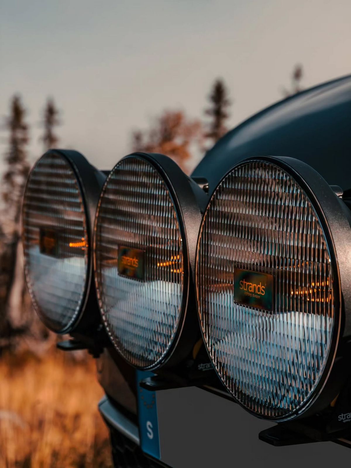 Strands LED auxiliary lights mounted on lifted VW Golf Alltrack wagon off-road build with protective grilles